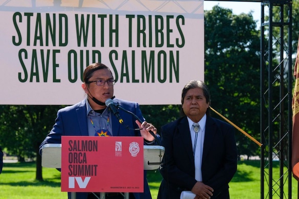 Jeremy Takala, a member of the Yakama Nation Tribal Council, speaks at a rally outside the U.S. Capitol on Thursday as Nez Perce Tribal Executive Committee Chairman Samuel Penney looks on. The event was organized by Northwest tribes in support of breaching the Lower Snake River dams to help restore salmon runs. (Orion Donovan-Smith, The Spokesman-Review)